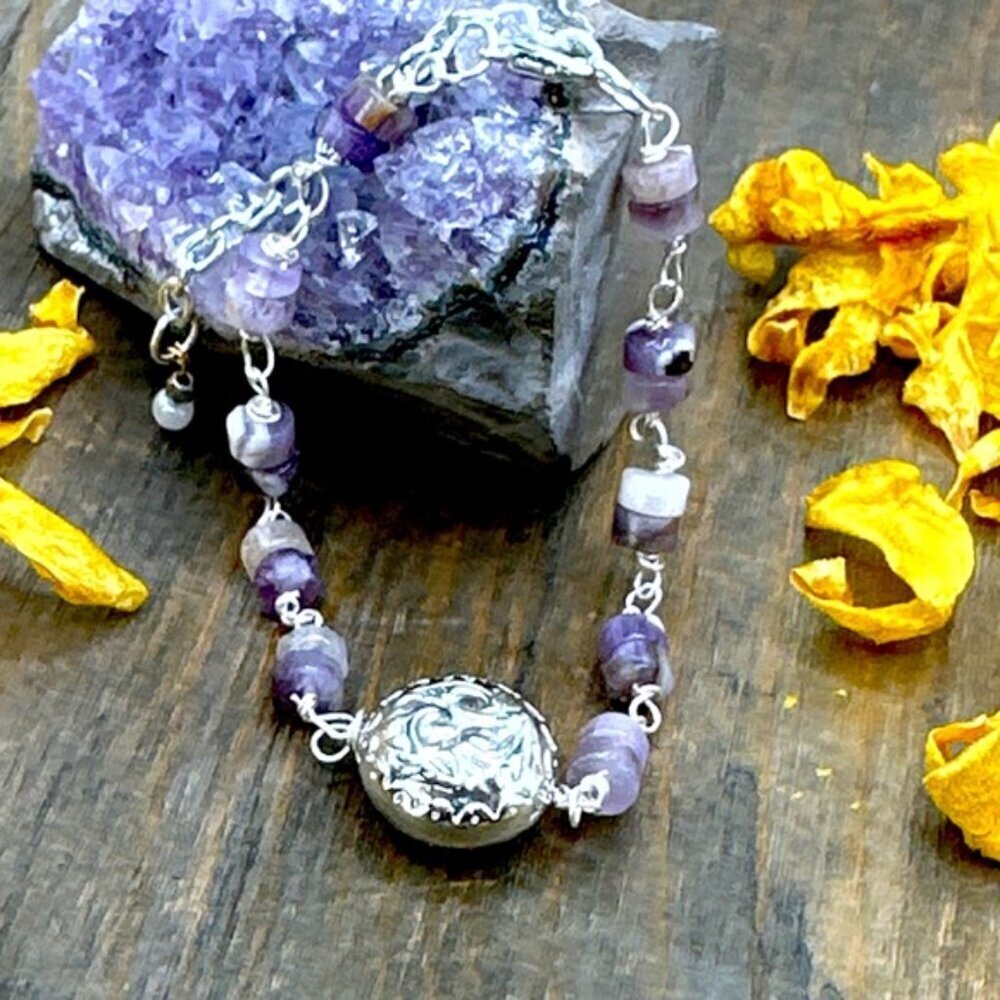 Amethyst and silver charm adorned luxury bracelet